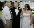 Jim Garrett with the bridal couple